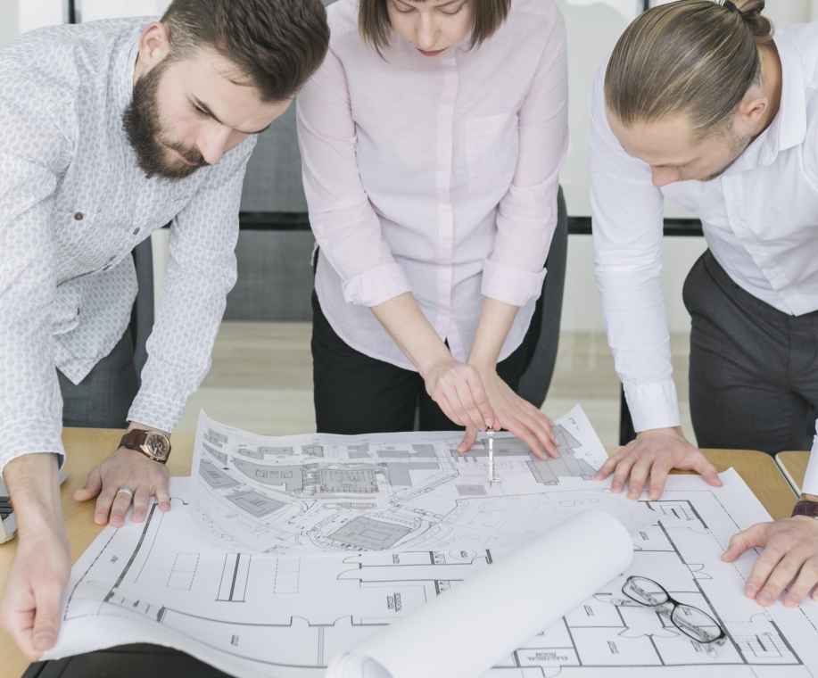 business-people-looking-plans-office